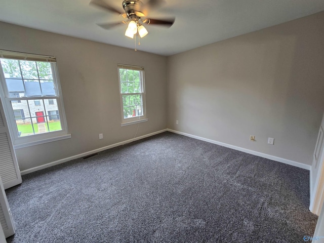 2005 Reaches Pl Unit B, Huntsville, AL 35802 - spare room featuring dark colored carpet, ceiling fan, and baseboards
