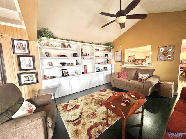 living room with ceiling fan, lofted ceiling, and wood walls