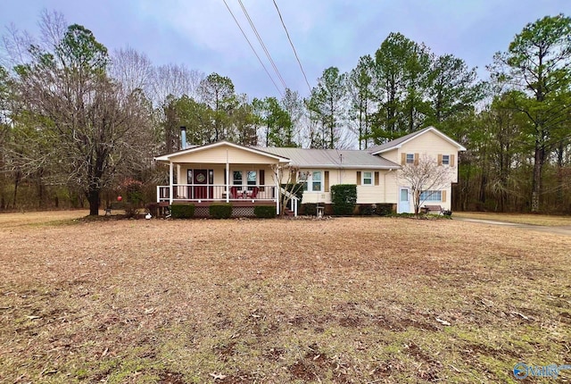 view of front of house with a garage and covered porch