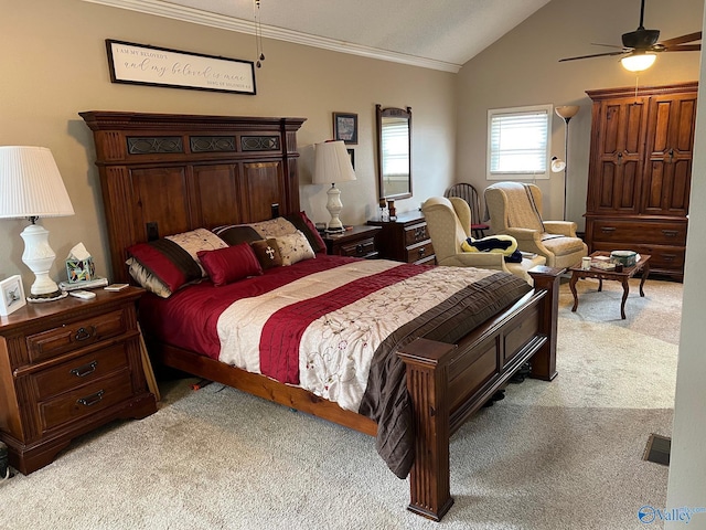 bedroom featuring lofted ceiling, crown molding, light colored carpet, and ceiling fan