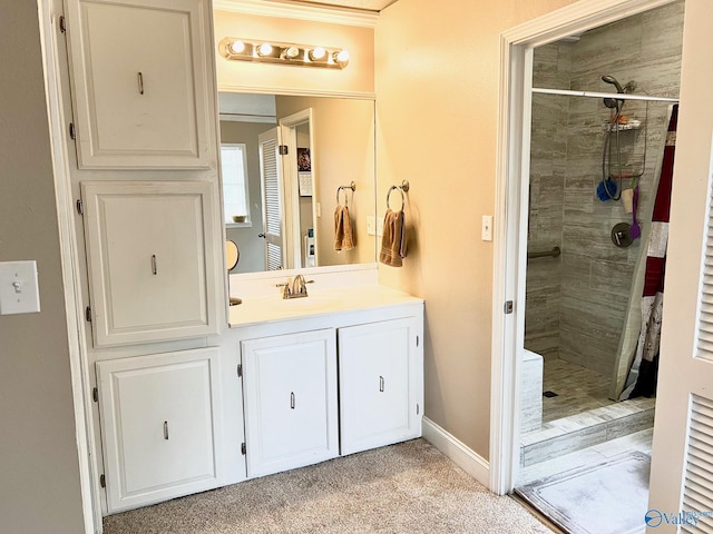 bathroom featuring vanity, tiled shower, and ornamental molding