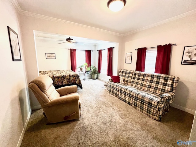 carpeted living room featuring ornamental molding and ceiling fan