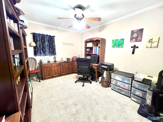 carpeted office space with ornamental molding and ceiling fan