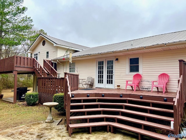 back of house featuring a wooden deck