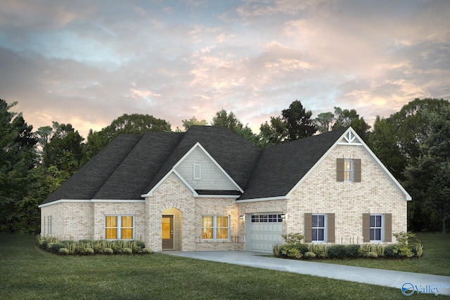 view of front of property with brick siding, a yard, driveway, and a garage