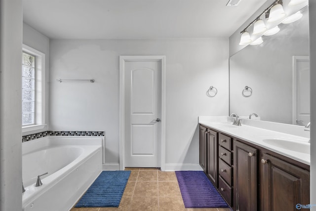 bathroom featuring tile patterned flooring, vanity, and a washtub