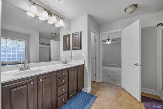 bathroom with ceiling fan, tile patterned floors, and vanity