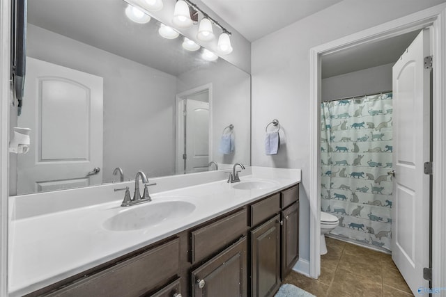 bathroom with a shower with shower curtain, vanity, toilet, and tile patterned flooring