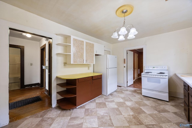 kitchen featuring open shelves, an inviting chandelier, white appliances, light countertops, and pendant lighting