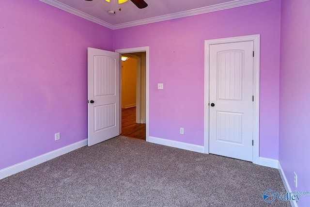 unfurnished bedroom with crown molding, ceiling fan, and carpet floors