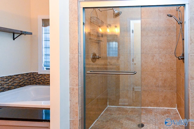 bathroom with independent shower and bath