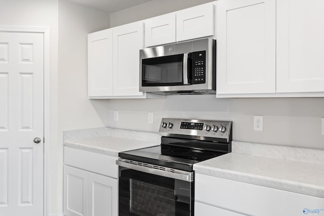 kitchen with white cabinets and stainless steel appliances