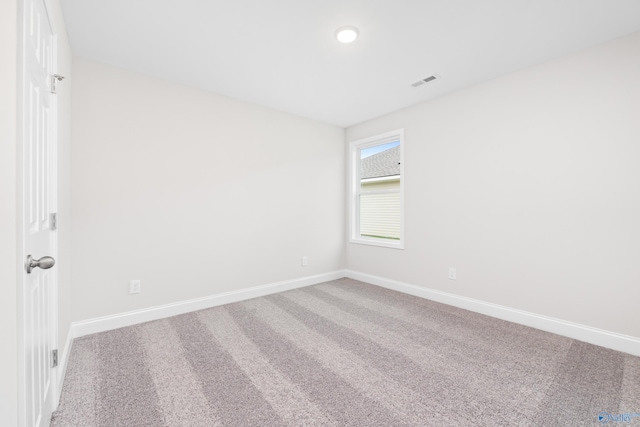 spare room featuring carpet