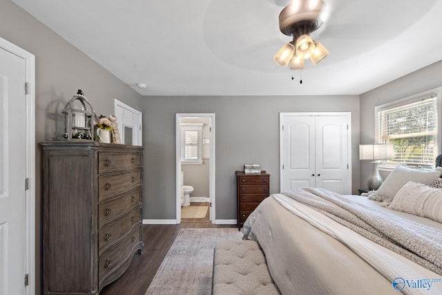 bedroom with a closet, connected bathroom, ceiling fan, and dark hardwood / wood-style flooring