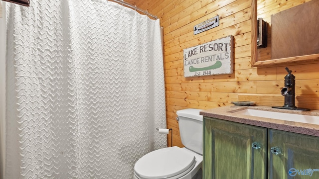 17395 County Road 31, Centre, AL 35960 - bathroom featuring a shower with curtain, wooden walls, toilet, and vanity