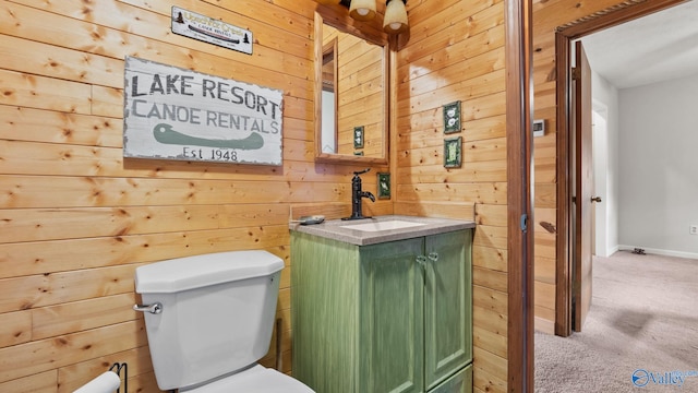 17395 County Road 31, Centre, AL 35960 - half bathroom featuring vanity, wooden walls, and toilet