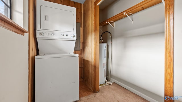 17395 County Road 31, Centre, AL 35960 - clothes washing area featuring baseboards, laundry area, water heater, and stacked washing maching and dryer