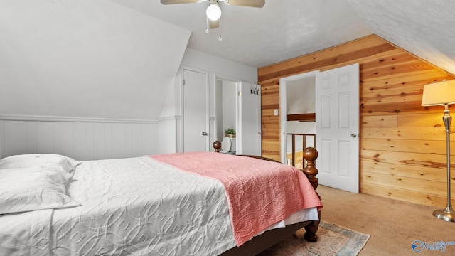 17395 County Road 31, Centre, AL 35960 - bedroom with lofted ceiling, carpet, and wood walls