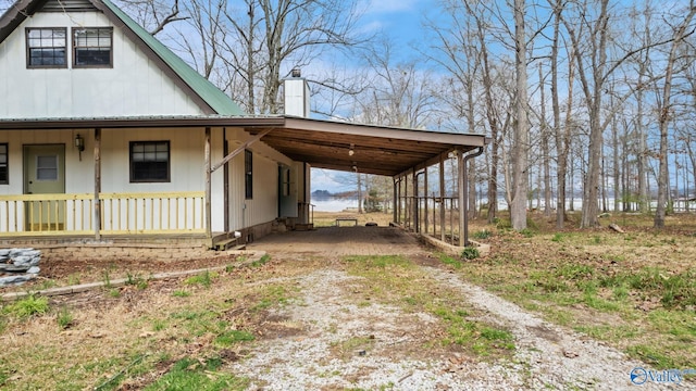 17395 County Road 31, Centre, AL 35960 - view of side of property featuring a porch, a chimney, metal roof, a carport, and driveway