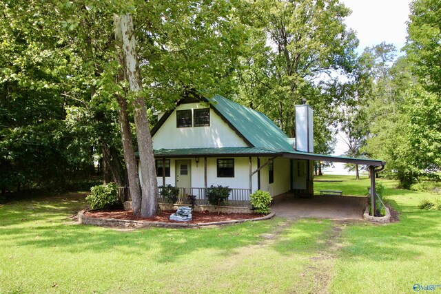 17395 County Road 31, Centre, AL 35960 - view of front facade with a chimney, an attached carport, a porch, and a front yard