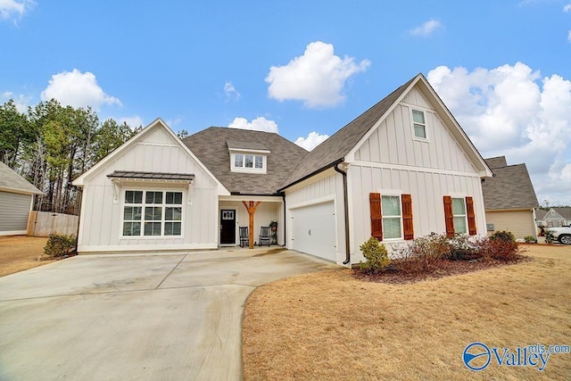 modern farmhouse style home featuring a garage