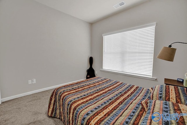 bedroom featuring light colored carpet