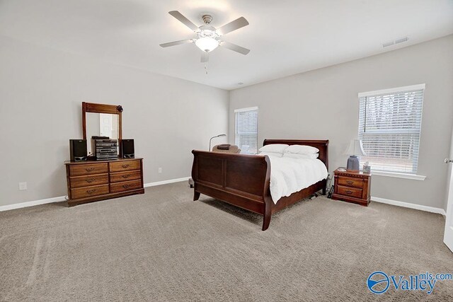 carpeted bedroom with ceiling fan