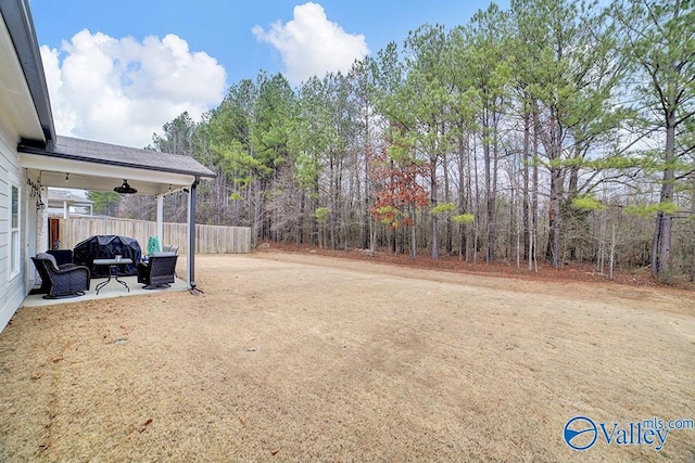 view of yard featuring a patio and ceiling fan