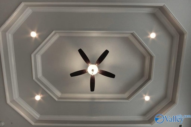 interior details featuring ornamental molding and a ceiling fan