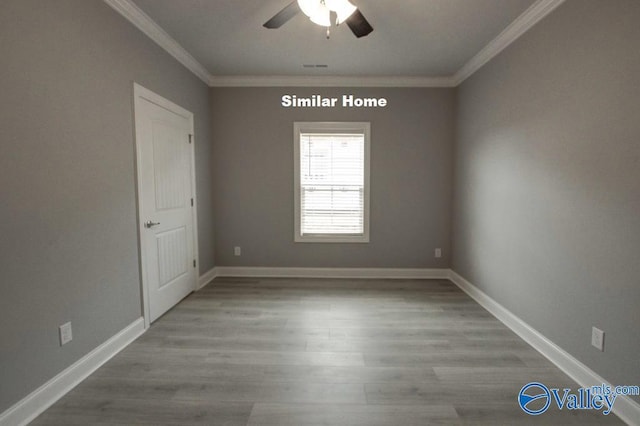 empty room featuring a ceiling fan, light wood-style flooring, baseboards, and crown molding