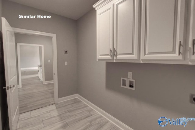 clothes washing area featuring cabinet space, baseboards, hookup for a washing machine, wood tiled floor, and hookup for an electric dryer