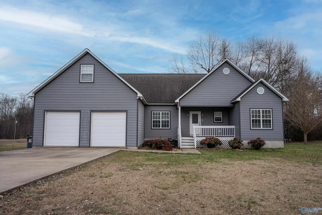 view of front of home featuring a garage, a front lawn, and covered porch