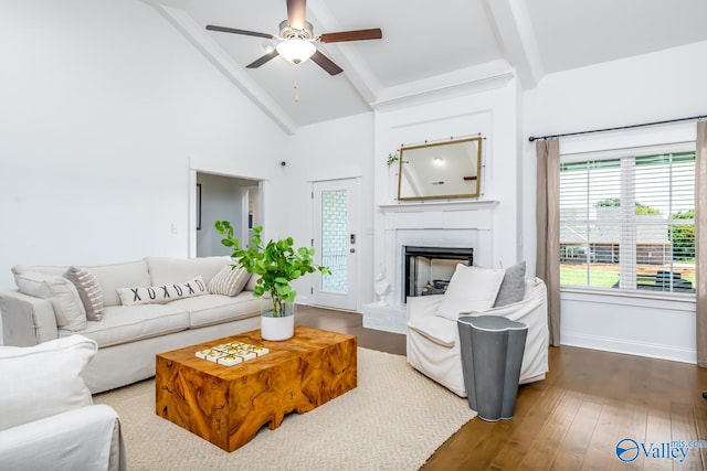 living room with beam ceiling, wood-type flooring, ceiling fan, and high vaulted ceiling