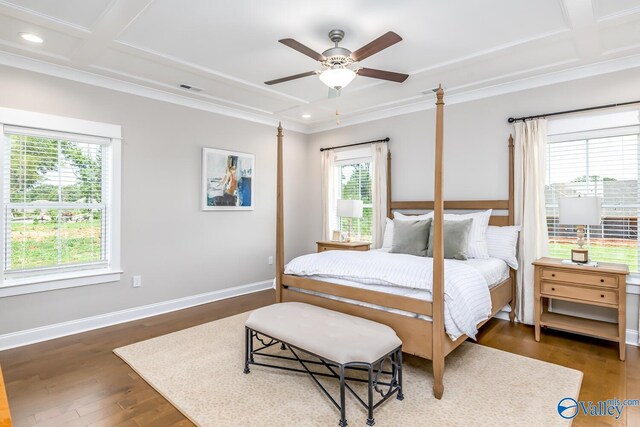 bedroom featuring multiple windows, dark hardwood / wood-style flooring, and coffered ceiling