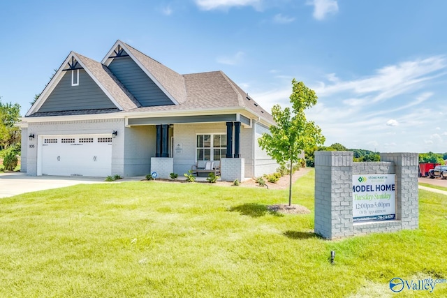 craftsman-style house featuring a garage and a front yard