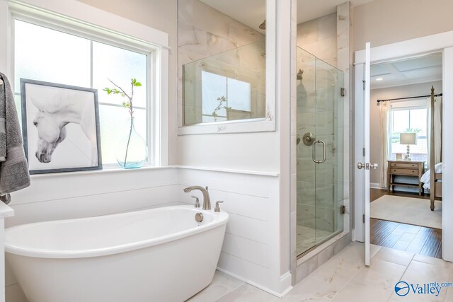 bathroom with plus walk in shower and tile patterned floors