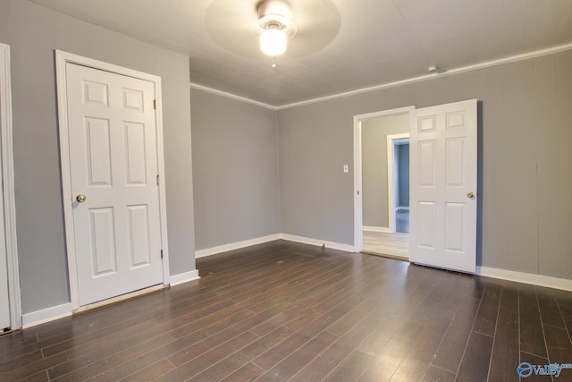 unfurnished room with ornamental molding and dark hardwood / wood-style flooring