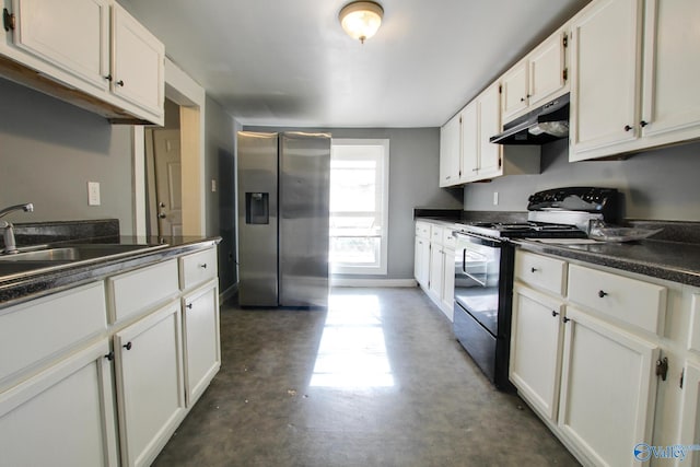 kitchen featuring black / electric stove, stainless steel fridge, sink, and white cabinets