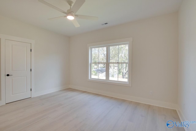 spare room featuring ceiling fan and light wood-type flooring