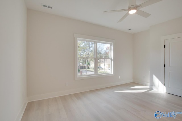 unfurnished room featuring ceiling fan and light wood-type flooring