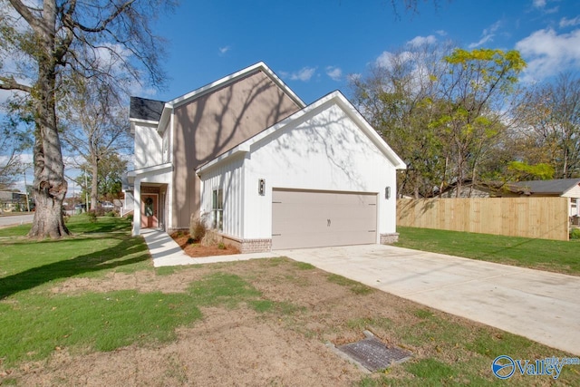 view of front of house featuring a front yard and a garage