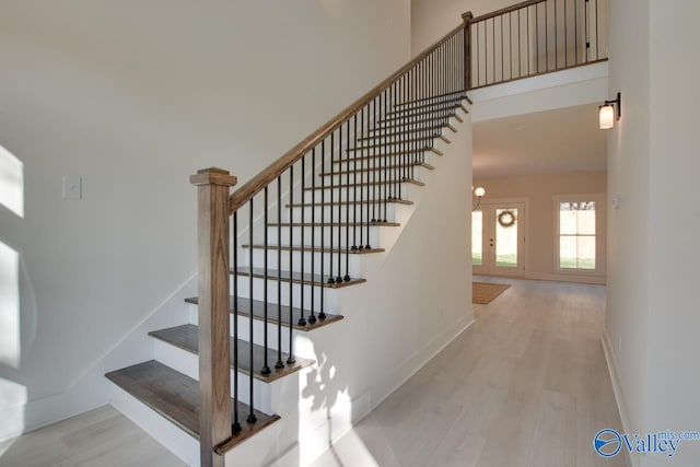 stairs featuring hardwood / wood-style flooring