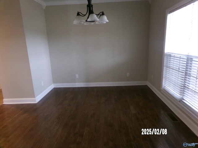 unfurnished dining area with dark hardwood / wood-style flooring and a notable chandelier