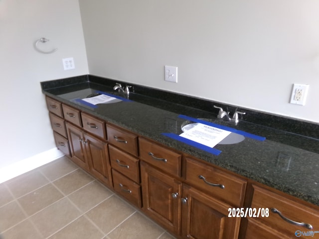 bathroom featuring tile patterned flooring and sink