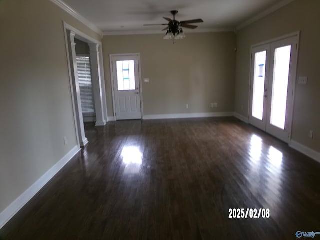 entryway featuring french doors, ornamental molding, dark hardwood / wood-style floors, ceiling fan, and decorative columns