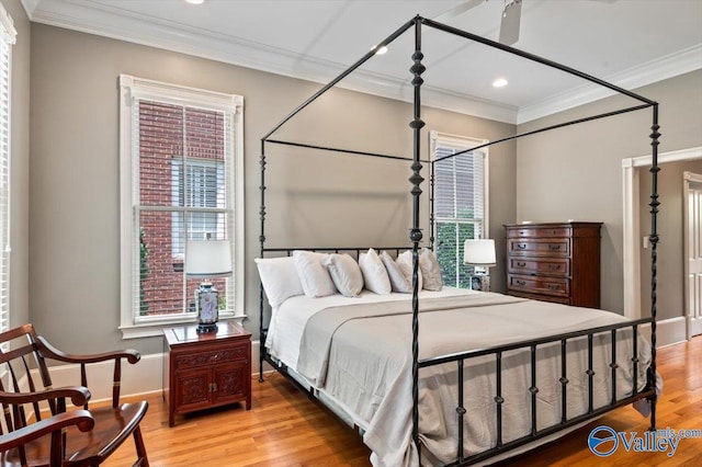 bedroom with baseboards, crown molding, light wood-style floors, and recessed lighting