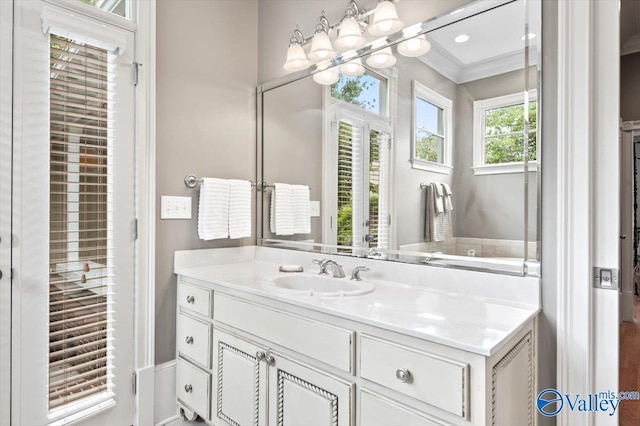 bathroom with vanity and ornamental molding