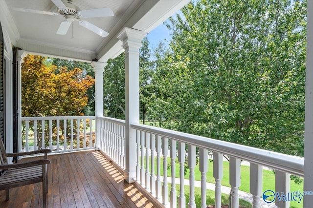wooden deck featuring ceiling fan