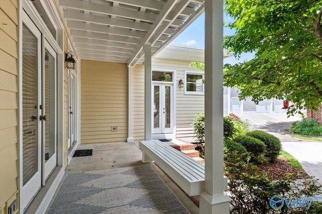 view of patio / terrace with a porch and french doors