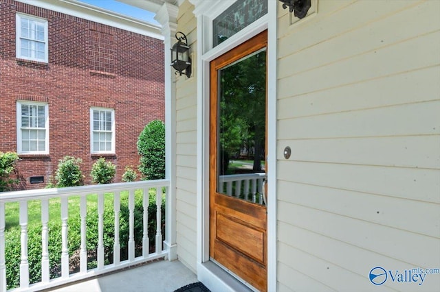 doorway to property featuring covered porch